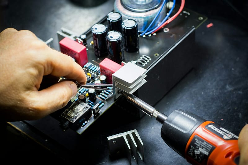 Technician repairing motherboard