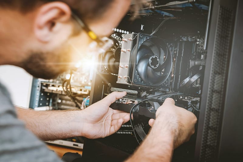 jeshoots-com-sMKUYIasyDM-unsplash Computer repair technician repairing computer