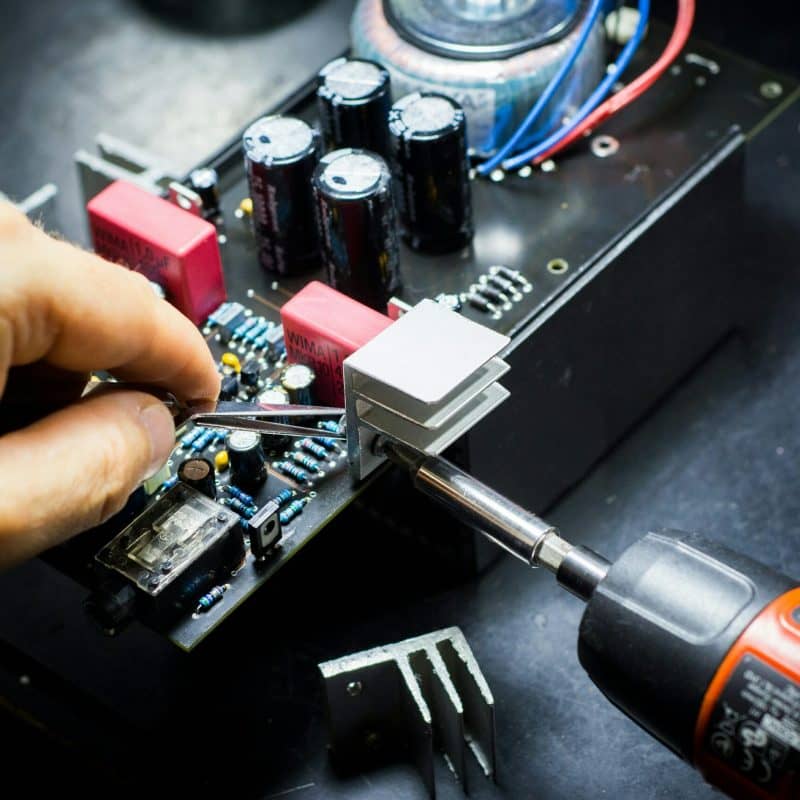 Technician repairing motherboard